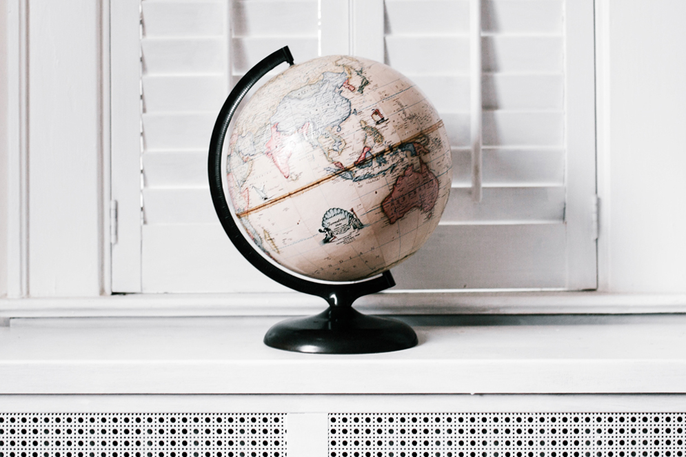 Globe on a white shelf